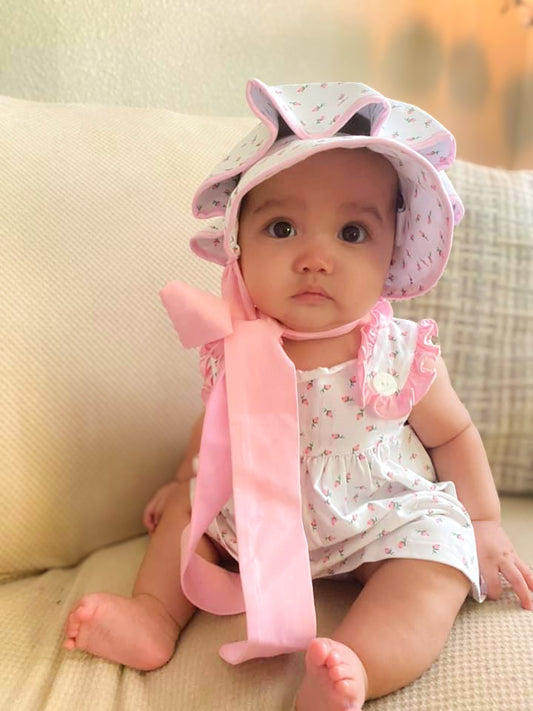 Kathleen is 6 months old wearing size 6M dress and 9M bonnet.
